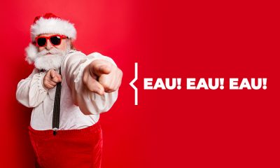 Plombier Expert | Père Noël cool avec lunettes de soleil sur fond rouge